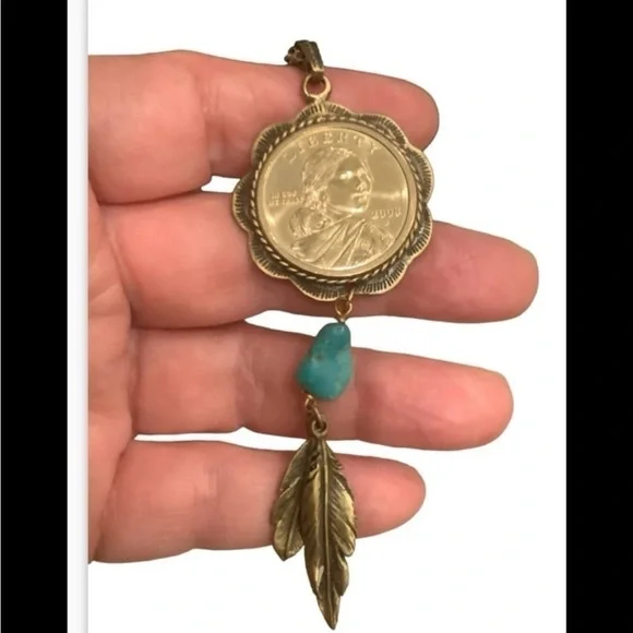 blue turquoise quarter dollar pendant hangs on a 24” gold tone necklace